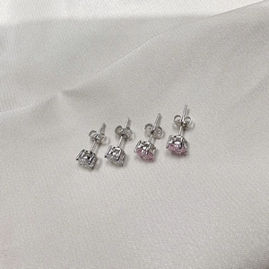 Classic 4-prong 925 silver stud earrings with 6mm pink and white cubic zirconia