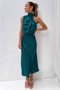 Detail of elegant dark teal satin sleeveless dress with halter neck and polished texture