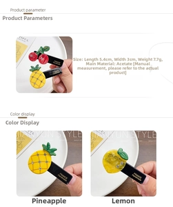 Detail of acetate fruit hair clips in cherry, pineapple and lemon shapes with rhinestones