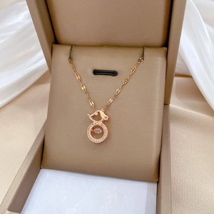 Elegant rose gold puppy necklace with dancing center stone in a premium gift box