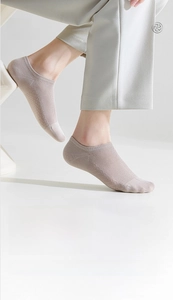 Detail of pure cotton no-show socks with mesh texture for breathable summer comfort