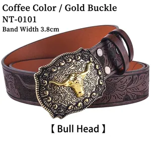 Detail of western cowboy leather belt with golden bull head buckle and floral embossing