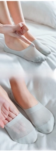 Close-up of light grey mesh low cut socks showing breathable cotton texture and fit