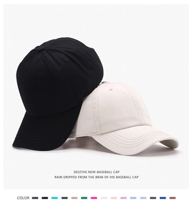 Close-up of classic baseball caps in black and beige with a multi-color selection palette