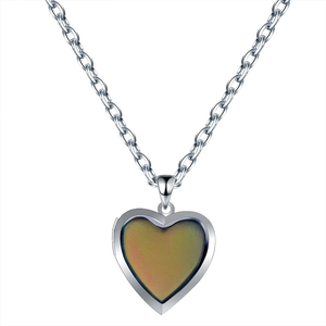 Detail of heart-shaped locket necklace with temperature-sensitive color-changing pendant