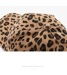 Macro detail of leopard print baseball cap featuring corduroy texture and vintage lettering