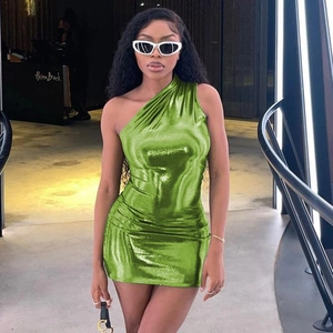 Close-up of lime green one-shoulder mini dress with ruched metallic finish texture