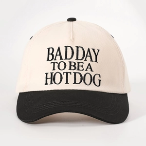 Retro two-tone baseball cap in beige and black featuring BAD DAY TO BE A HOTDOG embroidery