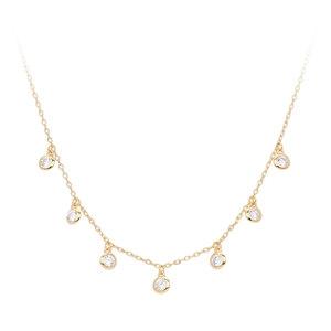 Detail of elegant gold necklace featuring seven sparkling round-cut zircon pendants