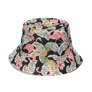 Tropical black bucket hat with pink flamingo and pineapple print for summer beach sun protection