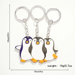Detail view of wooden penguin puzzle keychain with dimensions 10cm and weight 19g