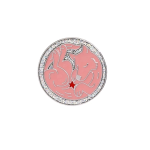 Detail of pink enamel animal pin with silver glitter border and red star accent