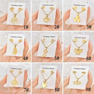 Collage of nine sets of gold stainless steel necklaces and matching animal stud earrings