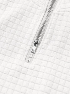 Macro shot of white waffle fabric texture and silver metal zipper on men sweatshirt
