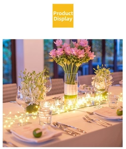 Close-up of warm white LED firefly string lights used for table centerpiece decoration