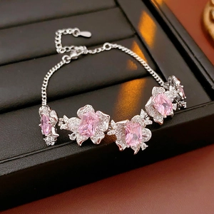 Detail of pink zircon flower bracelet with silver chain in a black leather gift box