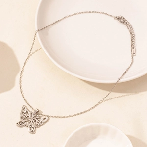 Detail shot of silver stainless steel butterfly pendant with lobster clasp and chain