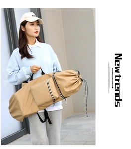 Detail of khaki canvas storage bag with drawstring closure and side zipper pocket