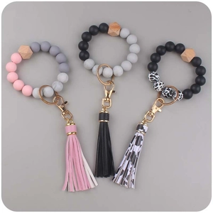 Silicone bead keychain bracelets with leather tassels in various stylish patterns