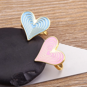18K gold-plated dopamine style heart rings with blue and pink enamel on a stone base