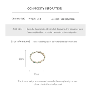 Detail view of 18cm gold copper bracelet featuring green oval zircon stones and clasp