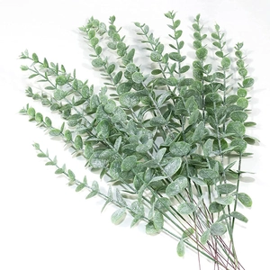 Macro detail of artificial eucalyptus leaves with realistic frosting texture and stems