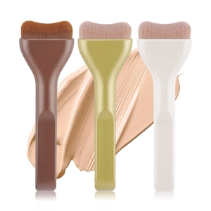 Flat tongue-shaped foundation brush set in olive green, brown, and cream colors
