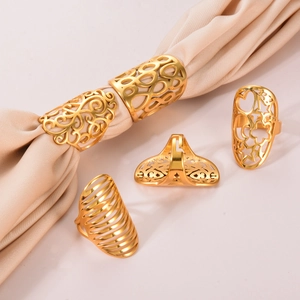 5-piece set of gold hollow-out stainless steel rings with floral and star patterns