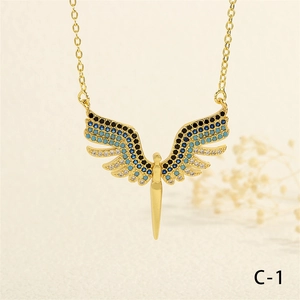 Close-up of golden wing pendant necklace with colorful cubic zirconia and O-chain detail