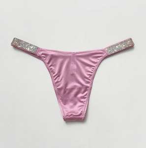 Detail of pink satin thong featuring shimmering rhinestone embellished side straps