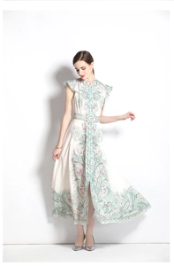 Detail of vintage palace print maxi dress with A-line silhouette and waist belt