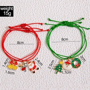 Christmas charm bracelet set with colorful enamel tree, reindeer and Santa charms on ropes