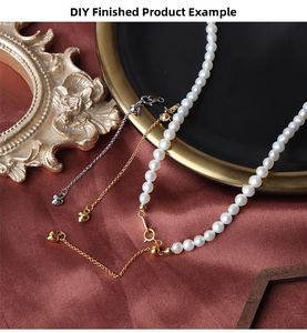 Detail of adjustable heart charm on silver extension chain for pearl necklace