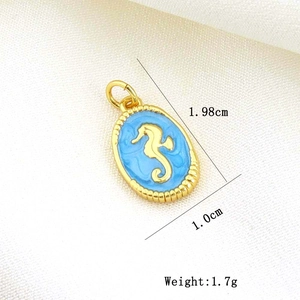 Macro view of gold-plated oval seahorse charm with blue enamel for DIY jewelry