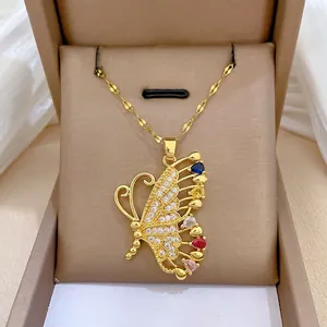Gold butterfly pendant necklace with colorful teardrop stones and pavé crystals on a chain