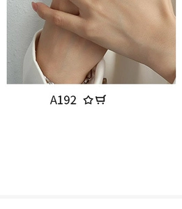 Close-up of silver beaded chain bracelet with A192 model tag on person wrist