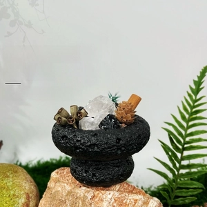 Close-up of essential oil aroma stone diffuser with volcanic rock and crystal stones