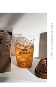Detail of high borosilicate glass cup with Stop Anxiety print and cartoon pattern