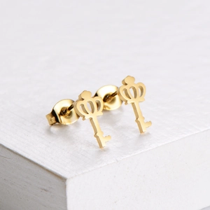 Elegant gold titanium steel crown and key stud earrings with a high-polished metallic finish