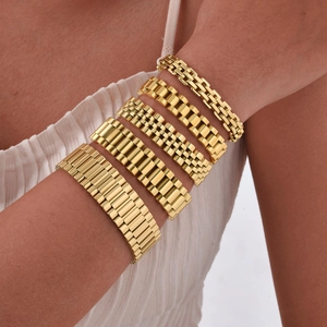 Four styles of golden stainless steel watch band bracelets worn on a model's wrist