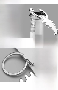Macro detail of silver lobster claw bottle opener keychain with durable metal ring