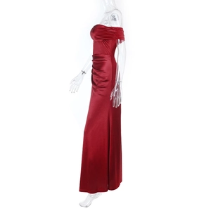 Detail of elegant red satin off-the-shoulder evening dress with a side slit and floor-length