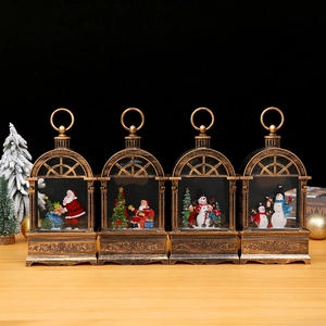 Vintage bronze Christmas lanterns with snow globe scenes of Santa Claus and snowmen