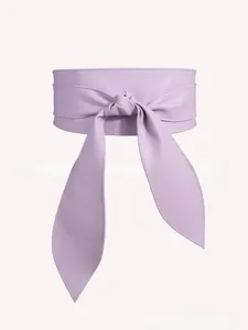 Detail of light purple faux leather wide waist belt with soft texture and bow tie design