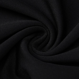 Close-up of black ribbed knit fabric showing fine texture and elastic stretch detail