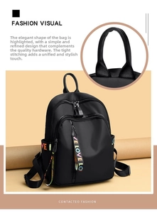 Close-up of lightweight black oxford backpack top handle and rainbow LOVE ribbon zipper
