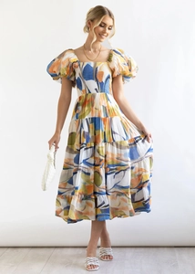 Detail of floral puff sleeve dress with abstract oil painting print and tiered hemline