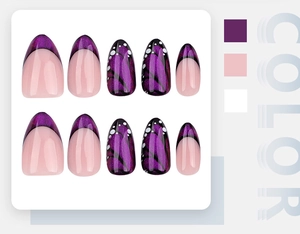 Detailed flat lay of purple cat-eye butterfly press-on nails with sequin French tips