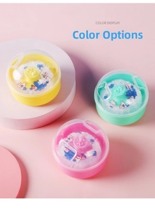 Detailed view of baby powder puff containers in yellow, mint green, and soft pink shades