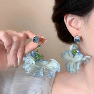 Elegant blue mesh flower earrings with green beads and metallic studs for women